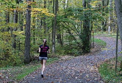 Student running the Allegheny River Valley Trail